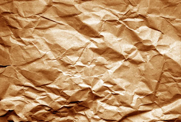 Old paper with wrinckles in brown tone. — Stock Photo, Image