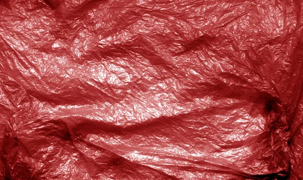 Plastic bag texture in red tone.