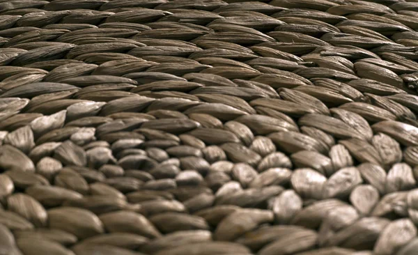 Round straw mat texture with blur effect.