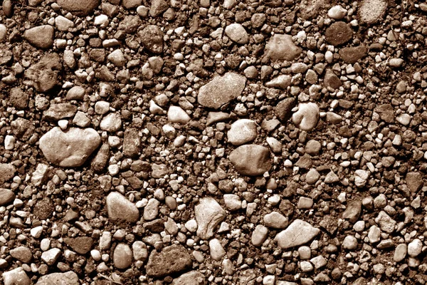 Pilha de pequenas pedras de cascalho em tom marrom . — Fotografia de Stock