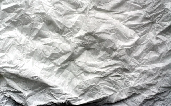 Zgnieciony arkusz białego papieru z efektem rozmycia. — Zdjęcie stockowe