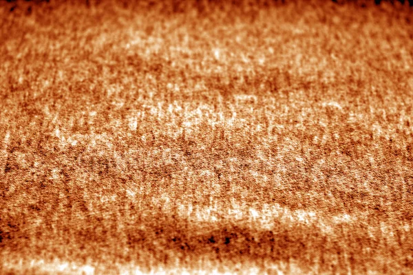 Textile texture with blur effect in orange color.