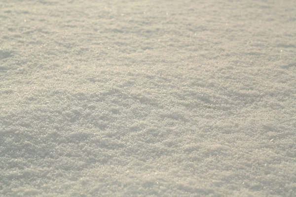 Fundo de neve branco brilhante com efeito de borrão . — Fotografia de Stock