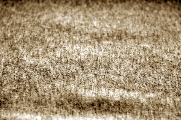 Textile texture with blur effect in brown tone.