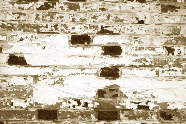 갈색 톤에 있는 오래 된 지저분한 벽돌 벽 텍스처. — 스톡 사진