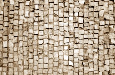 Kahverengi tonda taş kaldırım yüzeyi.