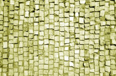 Sarı tonda taş kaldırım yüzeyi.