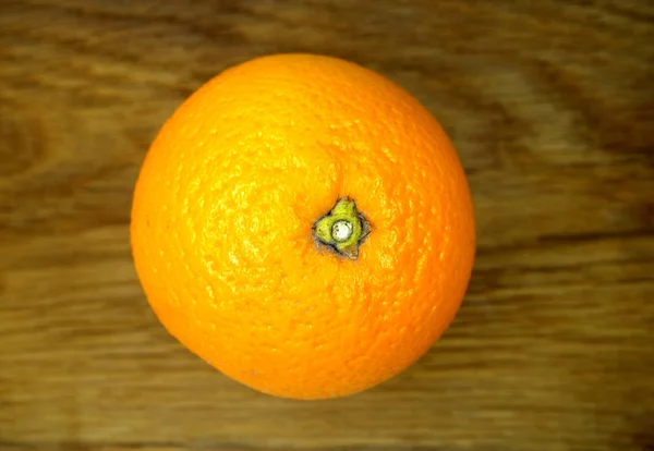 Mandarin orange on wooden board.