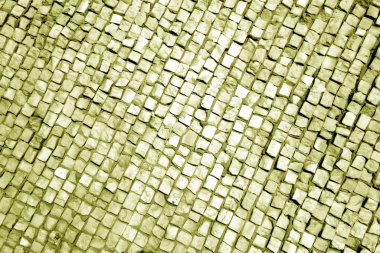 Sarı tonda taş kaldırım yüzeyi.