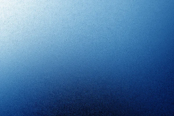Geschliffene Glasstruktur mit Licht mit Unschärfeffekt in Marineblau bis — Stockfoto