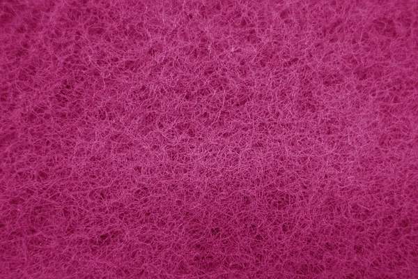 Limpeza da superfície de fricção da esponja close-up com efeito azul no pino — Fotografia de Stock