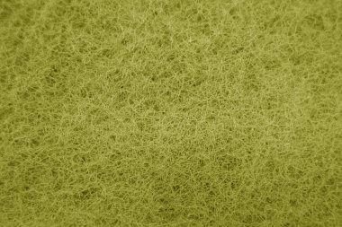 Sünger temizleme yüzeyi sarı tonda mavi efektle kaplanıyor. Tasarım için soyut arkaplan ve doku.