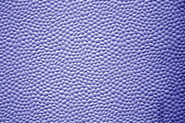 Bubbled metal sheet texture in blue tone. Abstract background and texture for design.