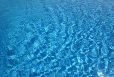 Yüzme havuzunda su var. Tasarım için soyut arkaplan ve doku.