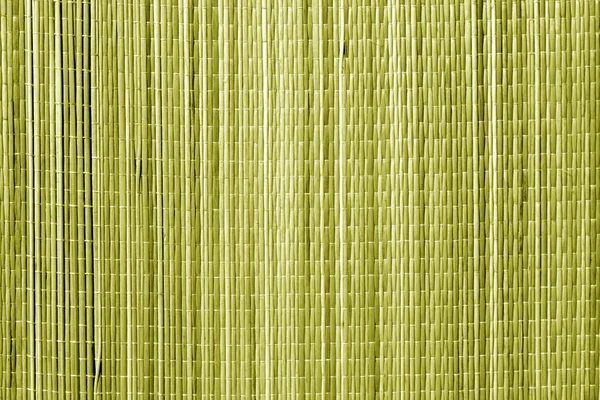 Straw mat texture in yellow tone. Abstract architectural background and texture for design.