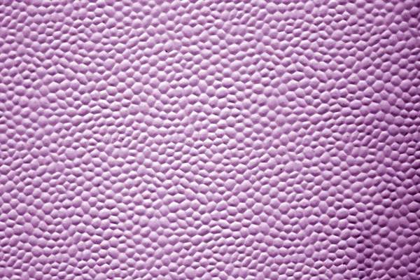 Bubbled metal sheet texture in purple tone. Abstract background and texture for design.