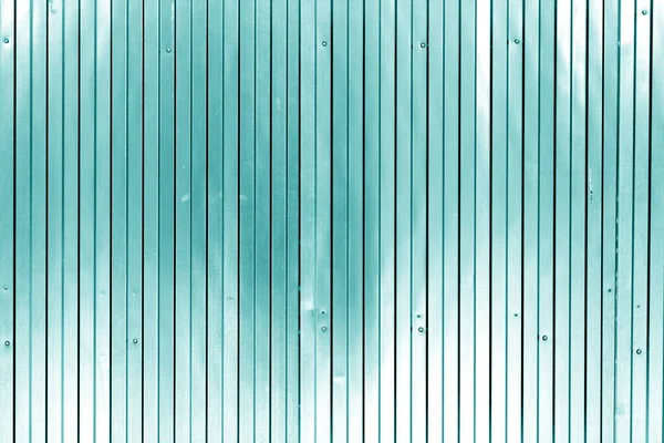Metal list wall texture of fence in cyan tone. Abstract background and texture for design.