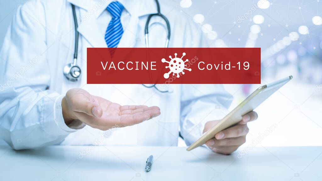 Close up of Doctor is showing medical analytics data of Coronavirus vaccine (Covid-19), Medical technology concept