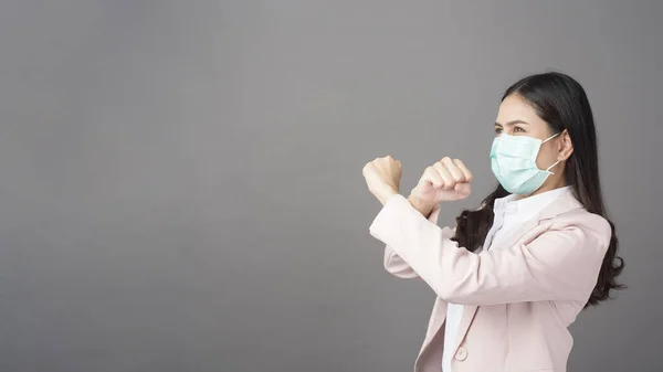 Business woman is wearing surgical mask , business protection concept