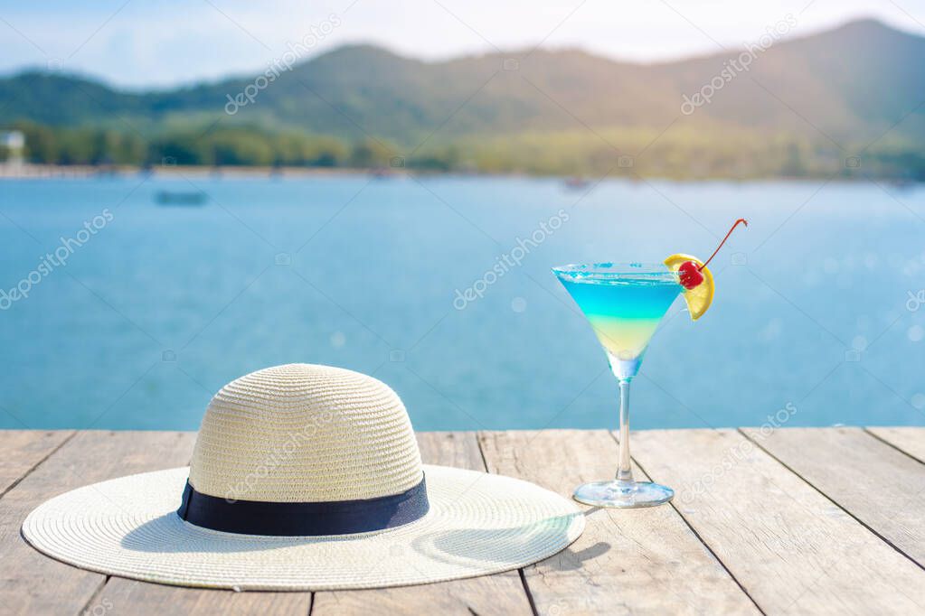 Summer background , White hat and summer drinking on beach 