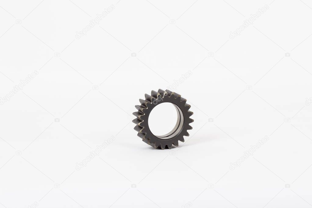 Small group of gears with their teeth engaged on a white background.