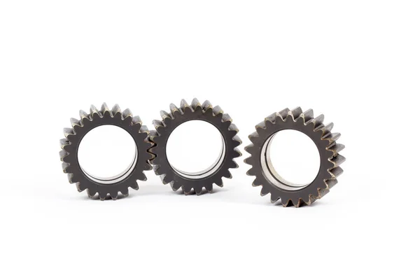 Small group of gears with their teeth engaged on a white background. — Stock Photo, Image