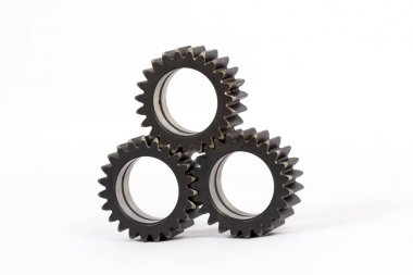 Gears ile dişlerini beyaz bir arka plan üzerinde meşgul küçük grup.