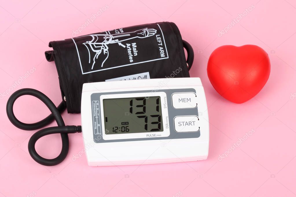 electronic blood pressure meter and red heart