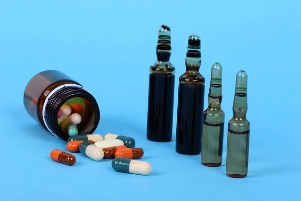 medical bottles isolated on blue background, drugs and