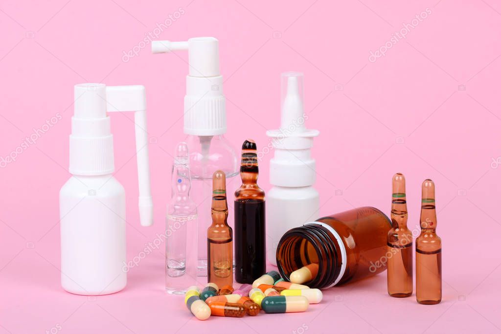 medical bottles isolated on pink background, drugs and