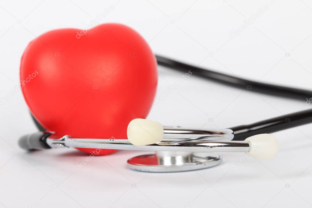 Stethoscope and heart isolated on white