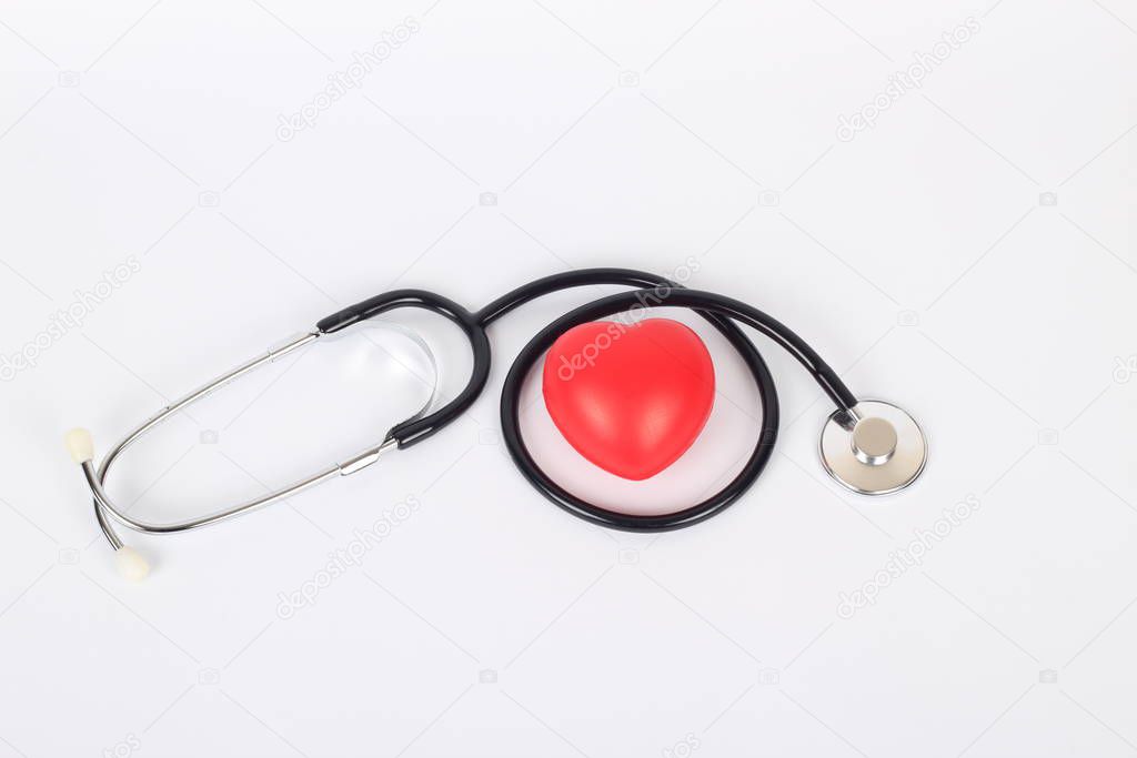 Stethoscope and heart isolated on white