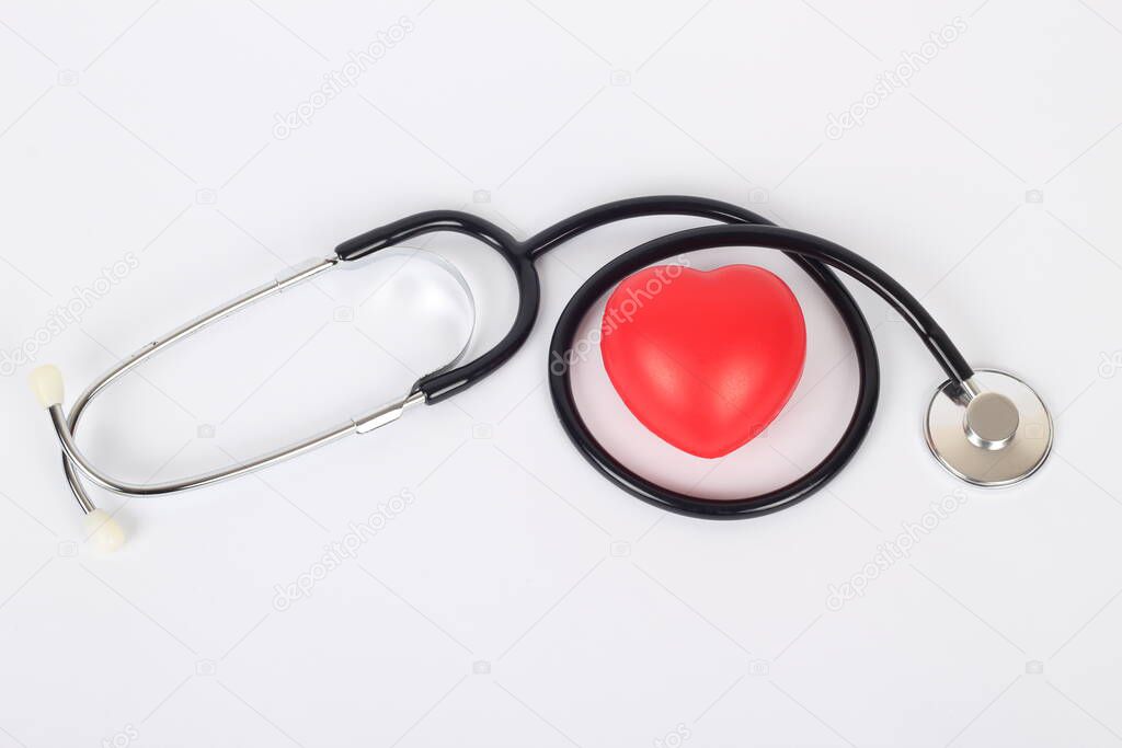 Stethoscope and heart isolated on white
