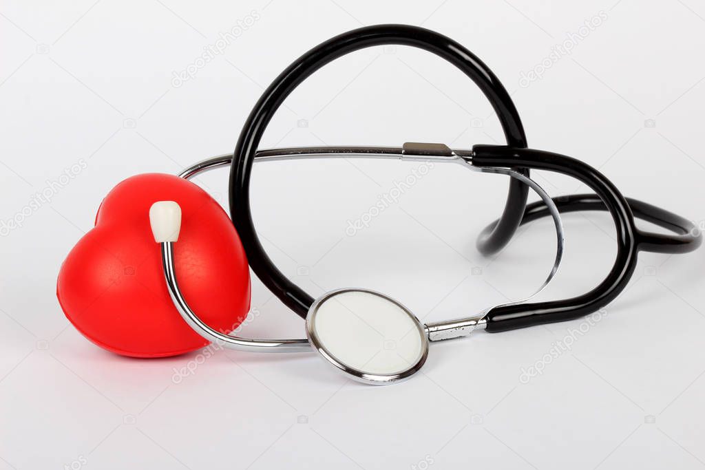 Stethoscope and heart isolated on white