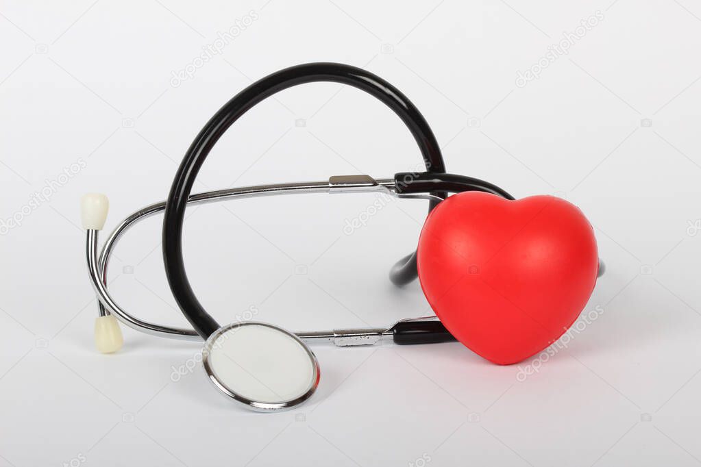 Stethoscope and heart isolated on white