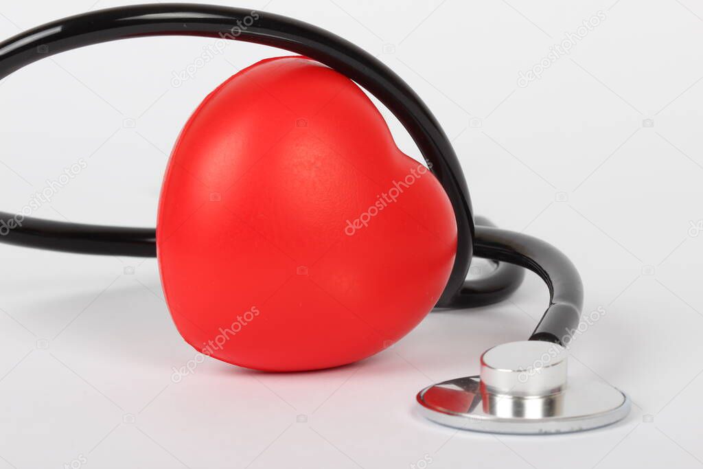 Stethoscope and heart isolated on white