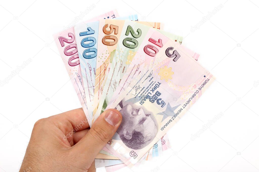 Turkey handful of paper money on a white background