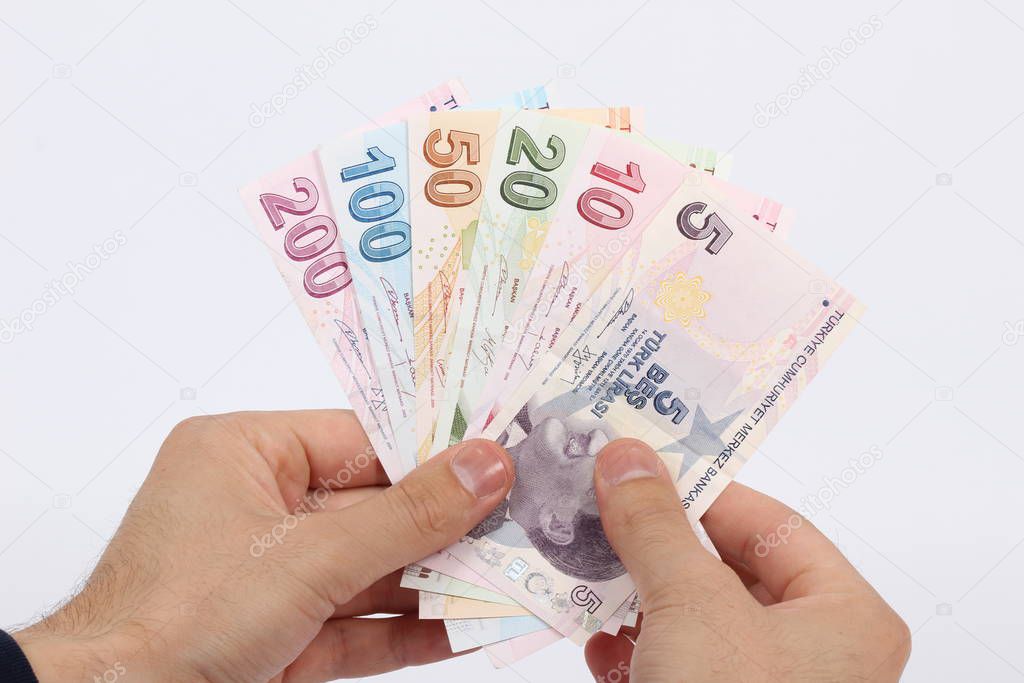 Turkey handful of paper money on a white background