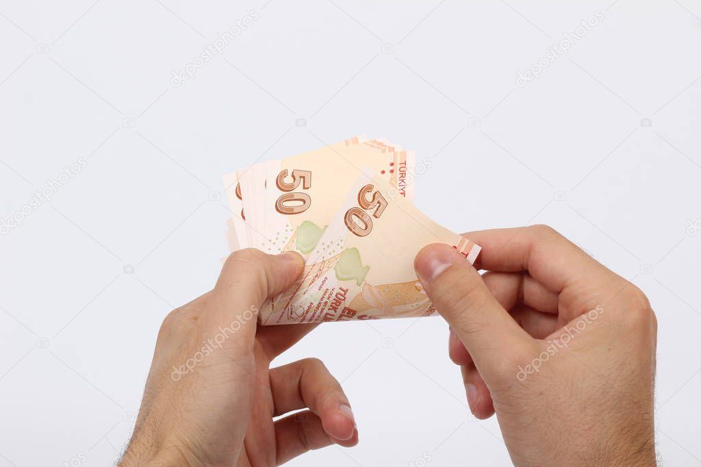 Turkey handful of paper money on a white background