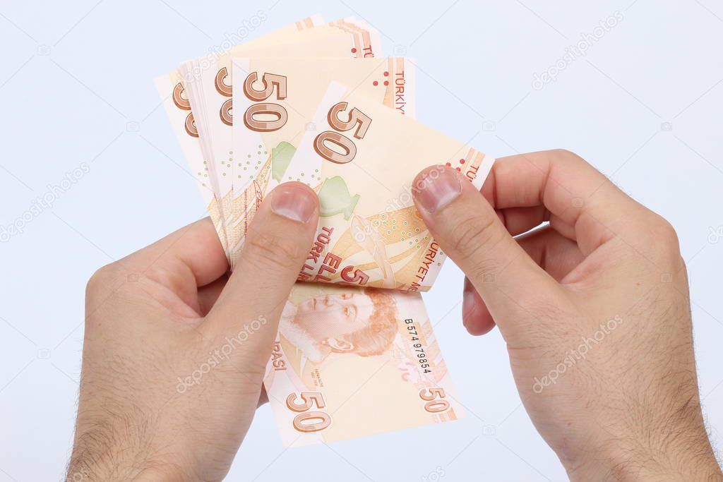 Turkey handful of paper money on a white background