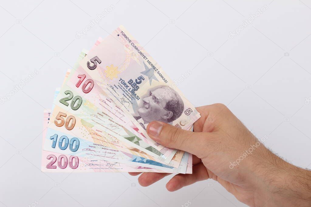 Turkey handful of paper money on a white background