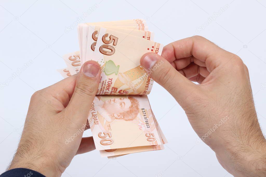 Turkey handful of paper money on a white background