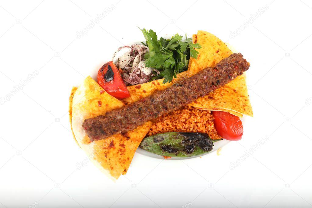 Turkish Adana Kebab with Vegetables on the Plate