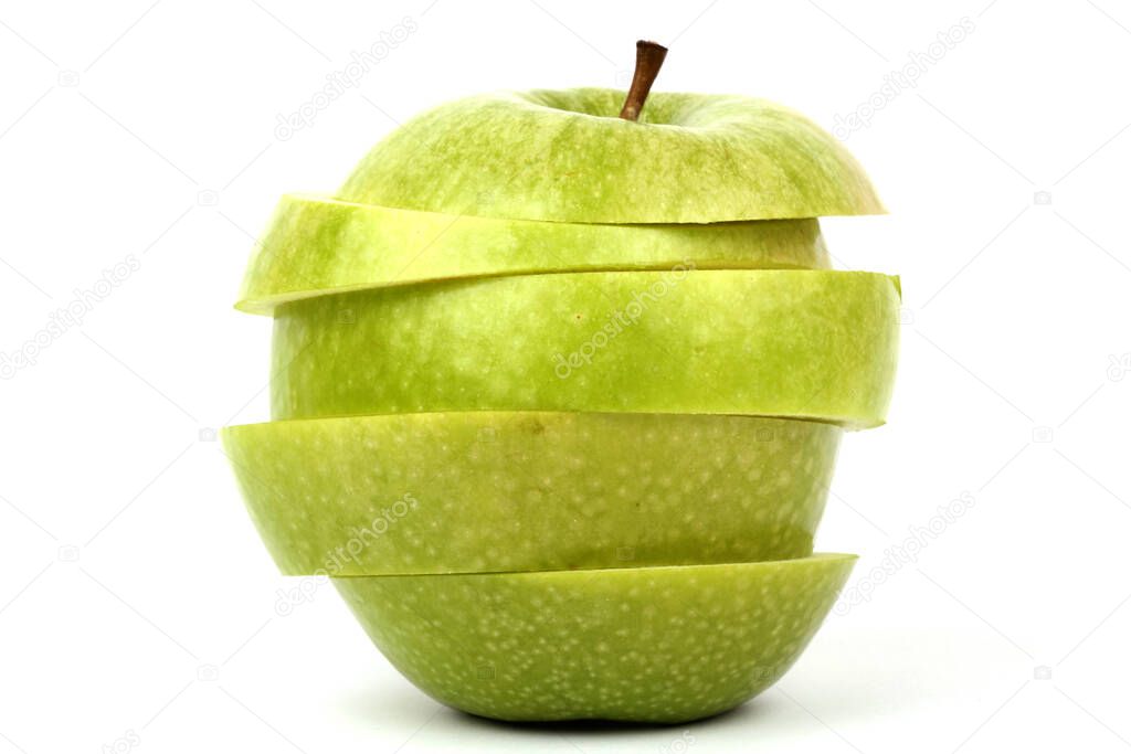 sliced red and green apple on white ground 