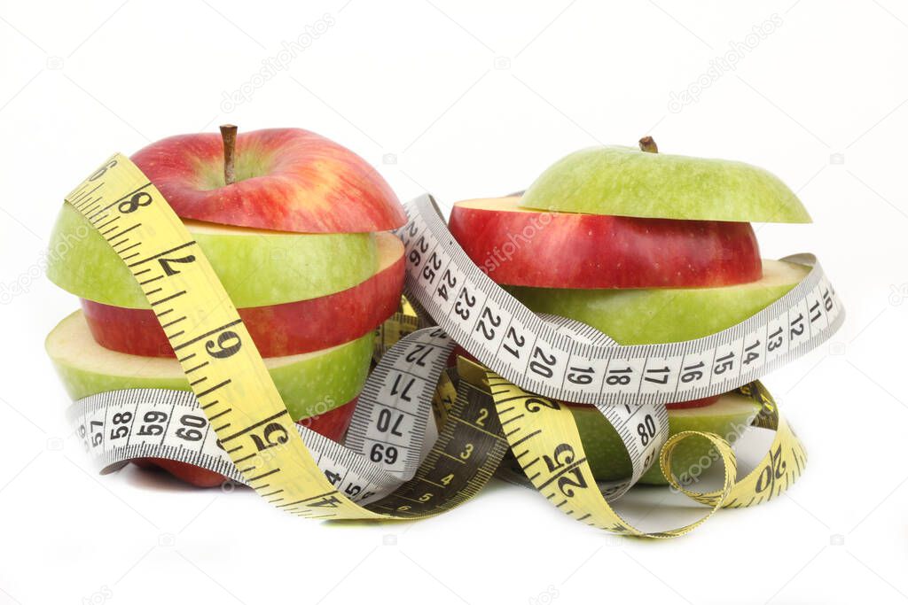 sliced red and green apple on white ground 