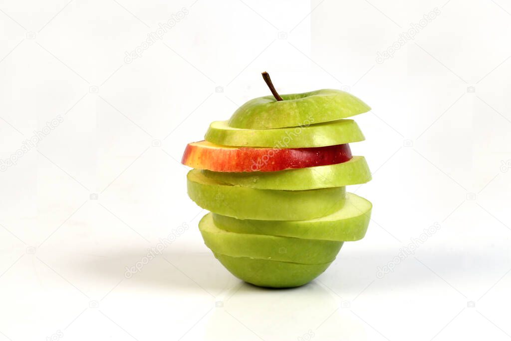sliced red and green apple on white ground 