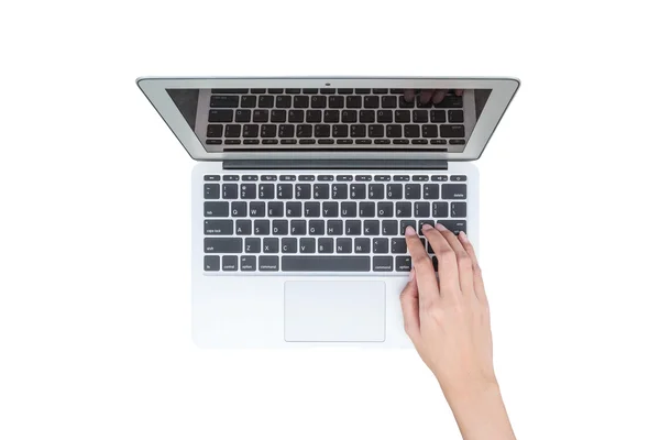 Primeros planos mujer escribiendo a mano en el teclado en el ordenador portátil gris aislado en el fondo blanco — Foto de Stock