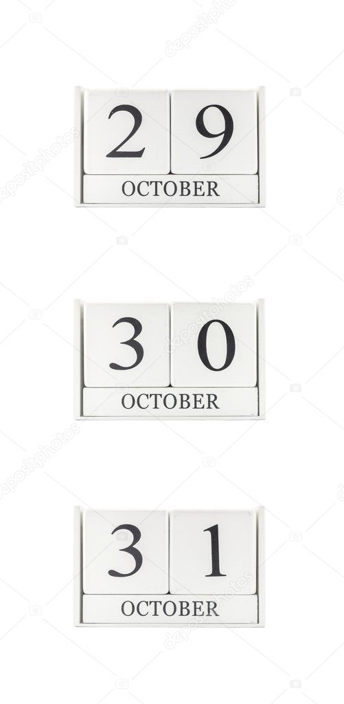Closeup group of white wooden calendar with black 29 , 30 , 31 october word , three date calendar isolated on white background