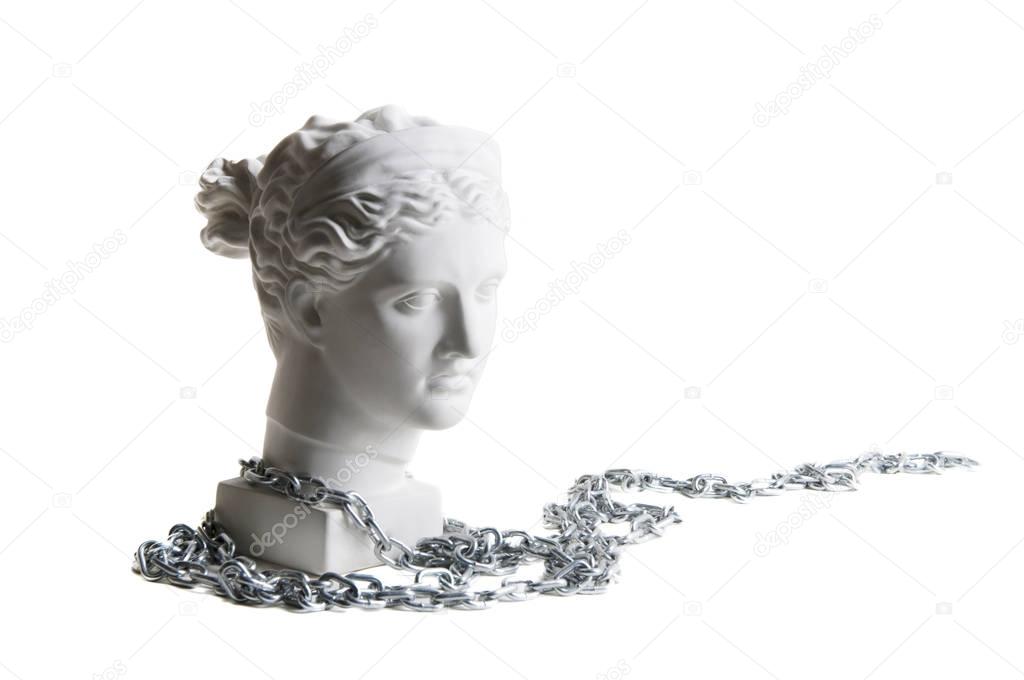plaster head of the goddess Diana in profile with chain