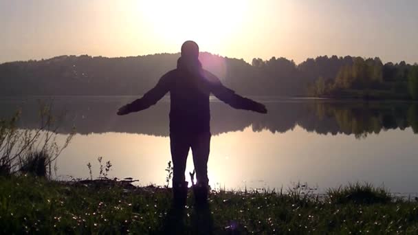 Man Stands His Arms Spread Wide Looks Rising Sun — Stock Video